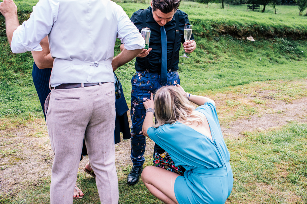 wedding guest caught on her knees with another friend in funny pose heart full of tea top tips