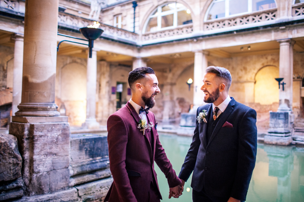 gay wedding at Roman baths stood right by the water at twilight