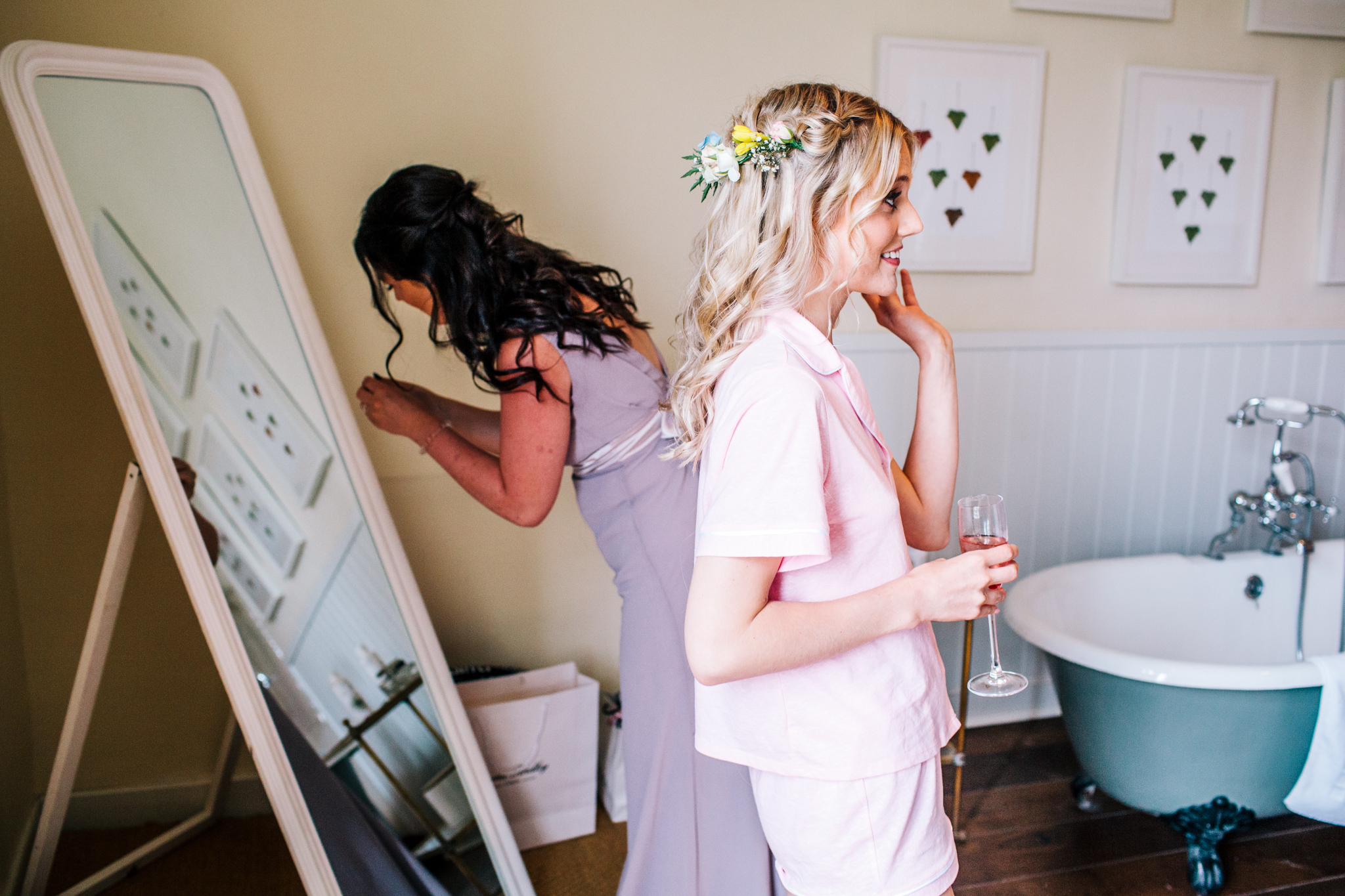 Bride getting flower crown positioned onto head
