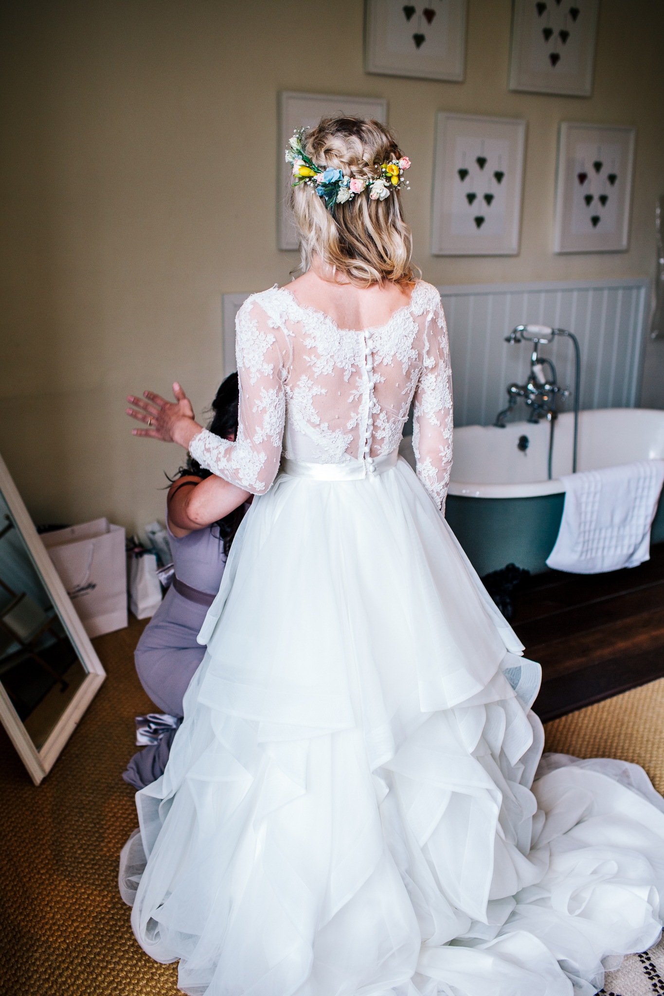 Bride wearing Emma Tindley separates of a lace top and layered skirt