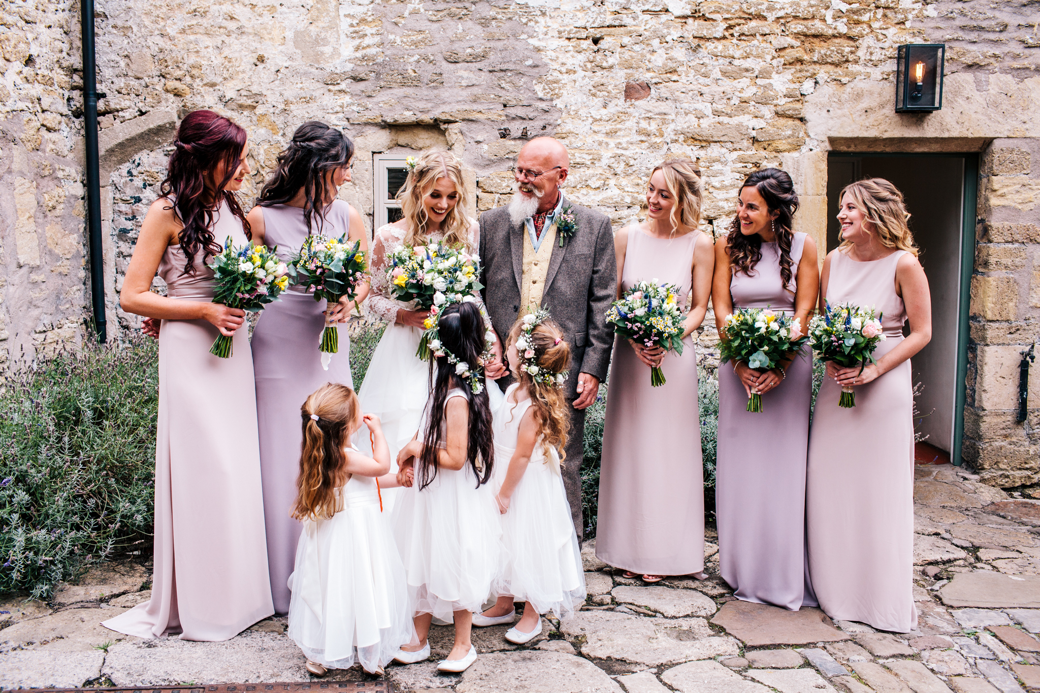 Group shot of bride and bridesmaid before the wedding at Mells Walled Garden
