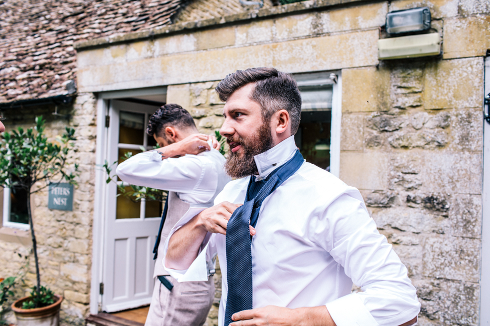 groom and friends in tweed suits at owlpen manor wedding venue
