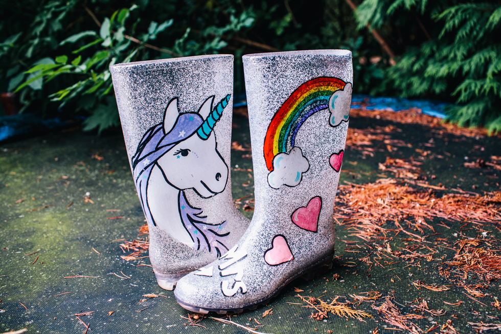 wedding wellington boots with a unicorn and rainbows drawn onto the side