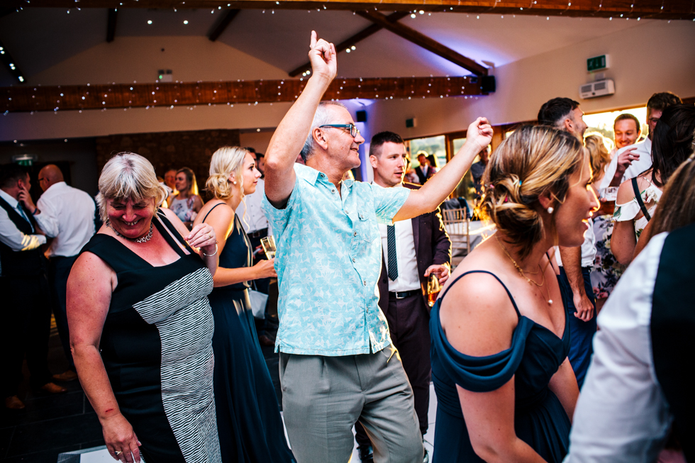 wedding guests going wild on dance floor at Quantock Lakes