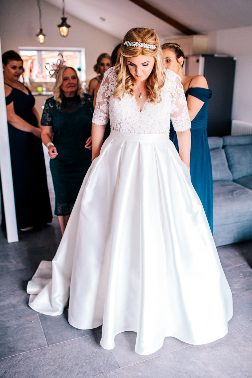 awesome alternative bride getting ready with hands in the pockets of her wedding dress
