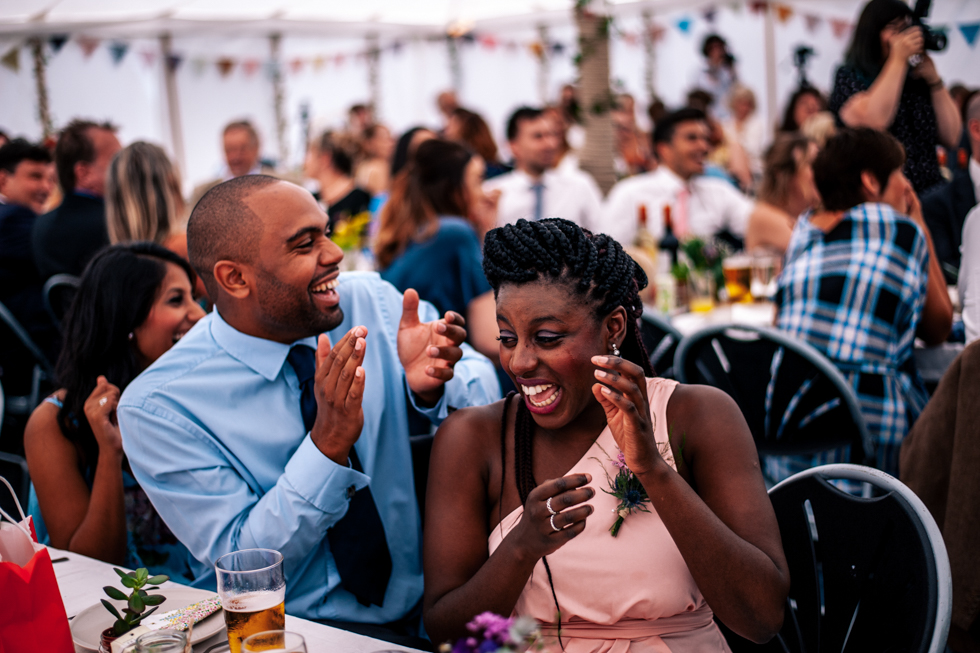wedding guest laughing at speeches